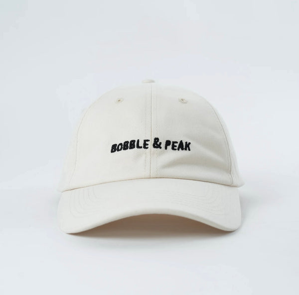 Limited edition white hat by Bobble & Peak with minimalist two-tone design