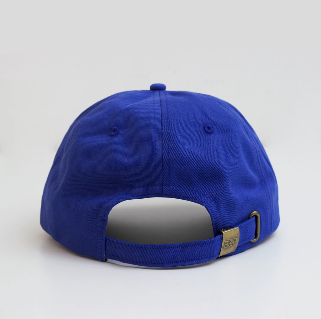Blue baseball cap on a light gray background